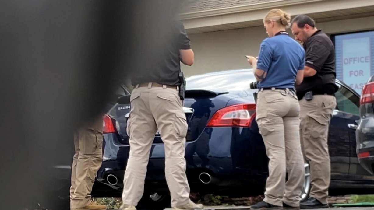 Officers investigate the death of 12-year-old Joshua Hancey, who died after being left in a hot car on July 21, 2021, at a care facility in American Fork.
