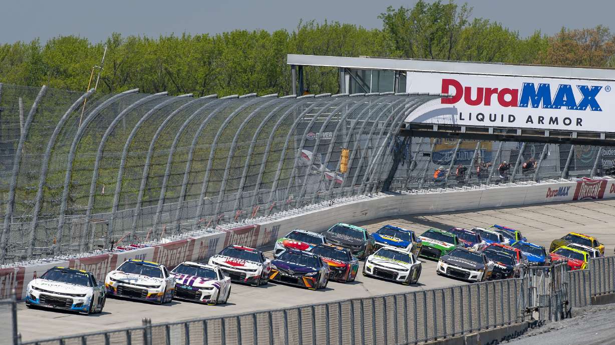 Justin Haley (31) leads going into the back straightaway during a NASCAR Cup Series auto race at Dover Motor Speedway, Monday, May 2, 2022, in Dover, Del.