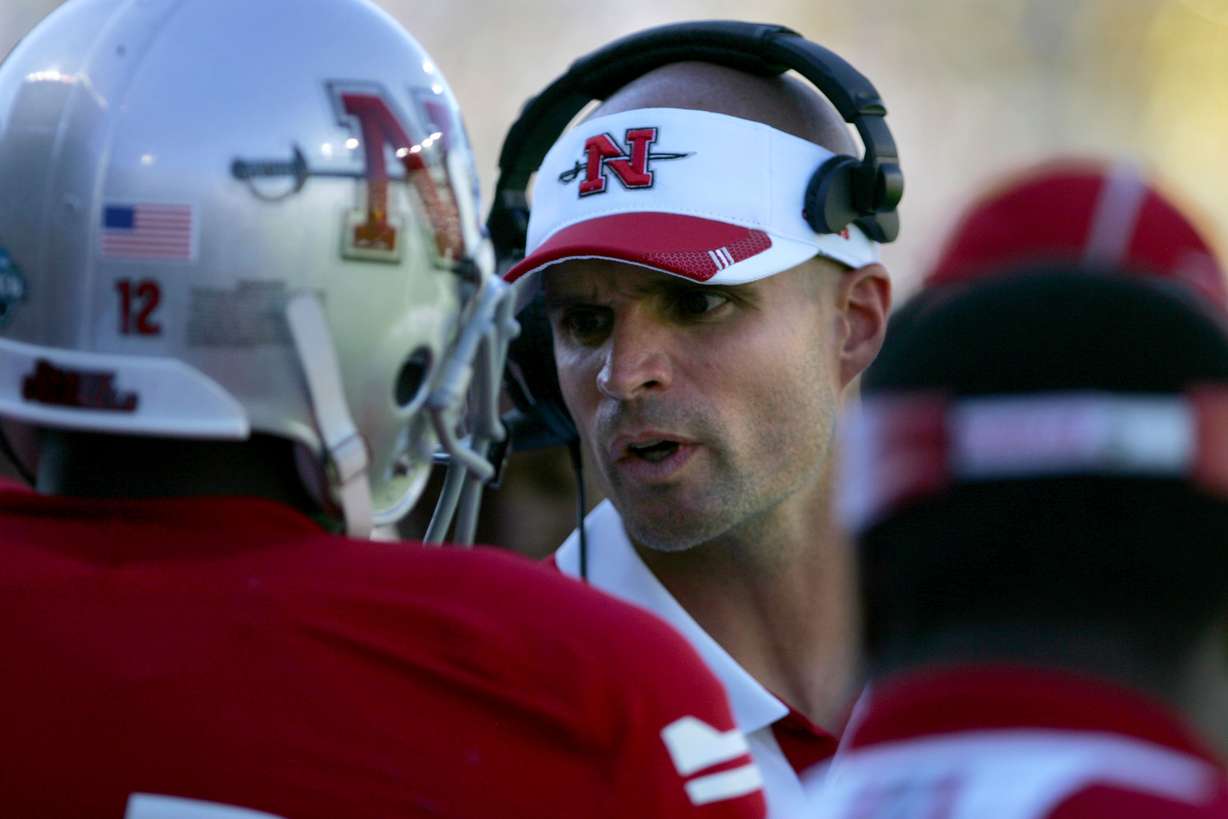 Nicholls State assistant coach Justin Anderson talks to a player during a game against Oregon in 2013.