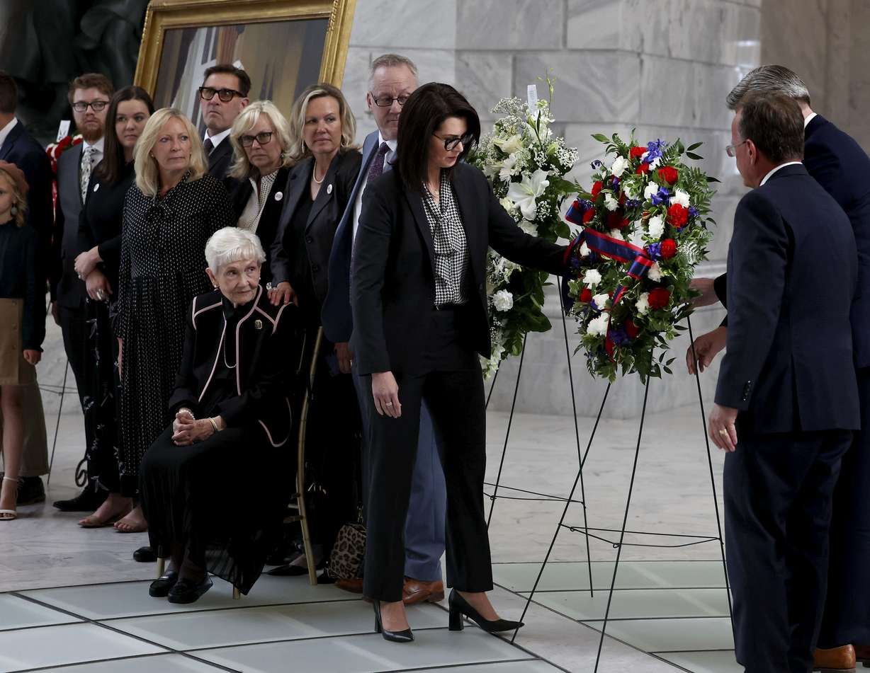Utah Lt. Gov. Deidre Henderson, State Treasurer Marlo Oaks and Senate President Stuart Adams place a wreath during the viewing of former Sen. Orrin Hatch as his family looks on at the Capitol in Salt Lake City on Wednesday. Hatch, the longest-serving Republican senator in U.S. history and the longest-serving from Utah, died April 23 at age 88.