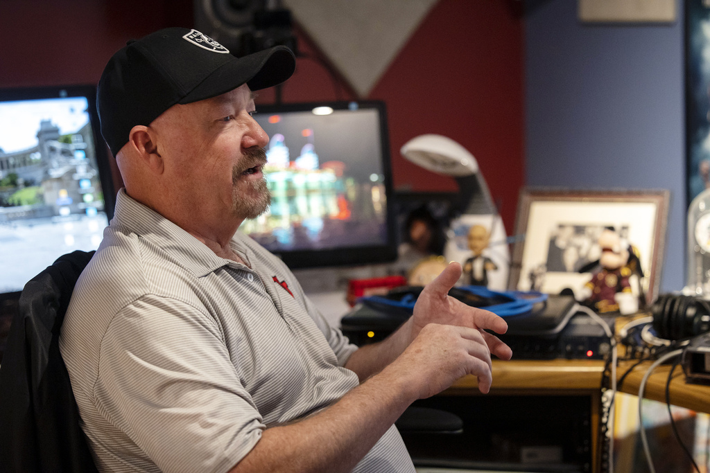 Radio personality Tim Hughes sits in his home studio during an interview with Lee Benson in West Jordan on Oct. 26, 2021.