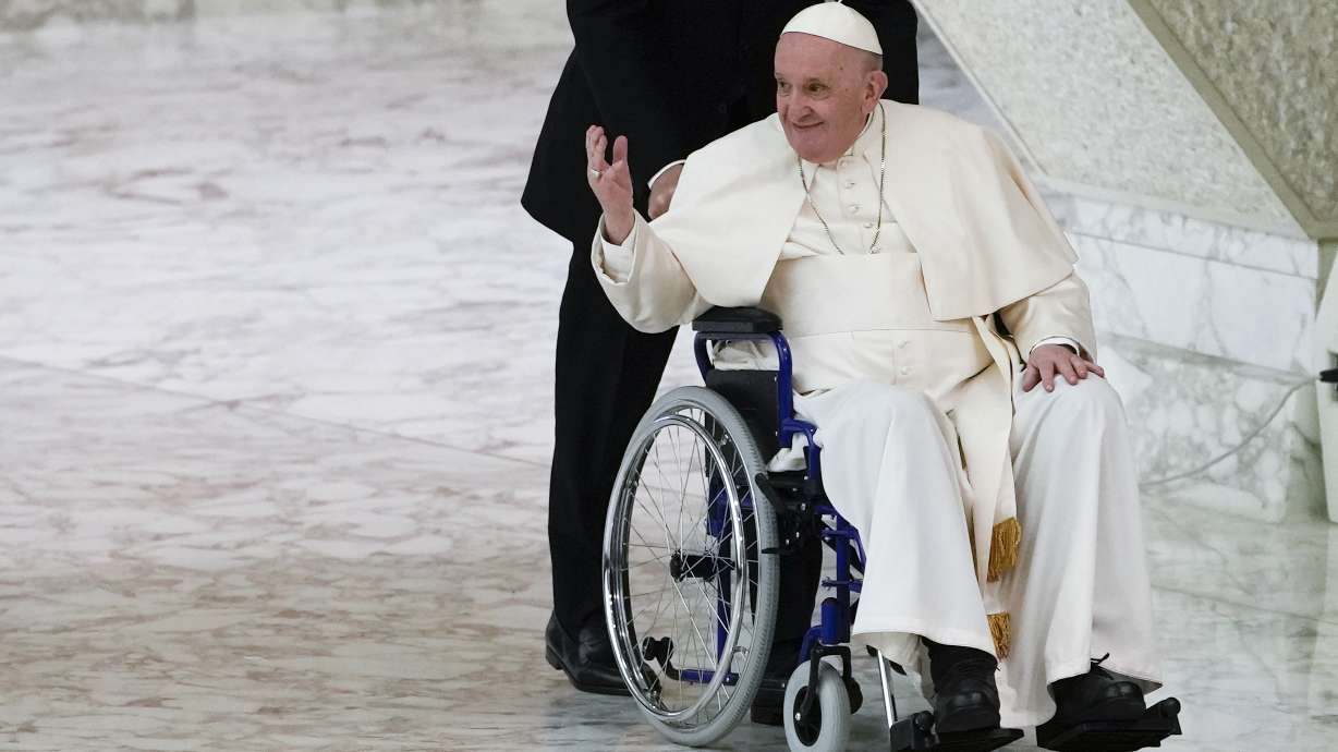 Pope Francis arrives in a wheelchair to attend an audience with nuns and religious superiors in the Paul VI Hall at The Vatican, Thursday. A cardinal has testified that Pope Francis authorized spending up to 1 million euros to free a Colombian nun kidnapped by al-Qaida-linked militants in Mali.