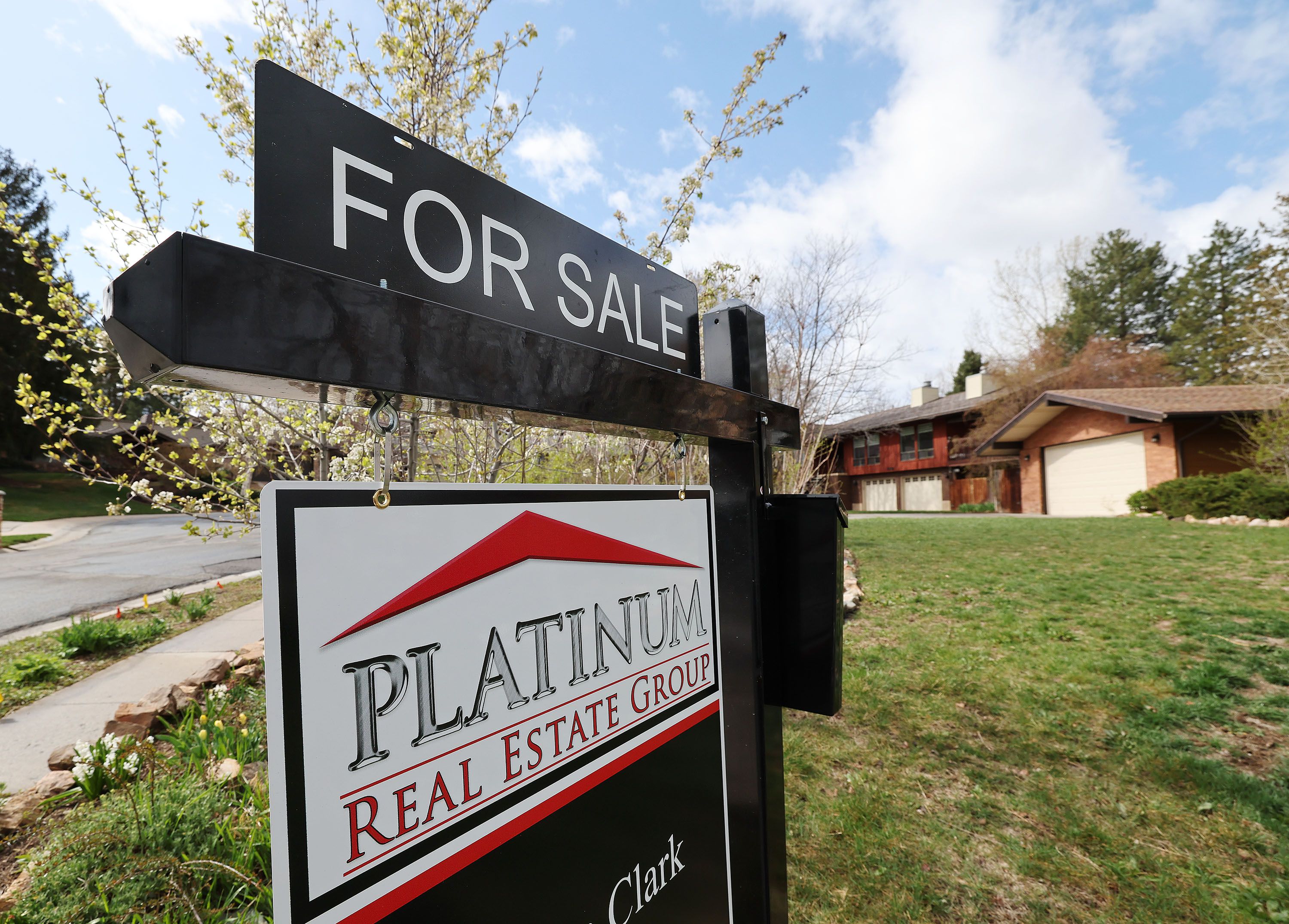 A “for sale” sign is pictured at a home in Cottonwood Heights on April 15. The booming housing market has largely contributed to the U.S.’s economic comeback from COVID-19, but today the market is facing a cloud of uncertainty, the National Association of Realtors’ chief economist says.