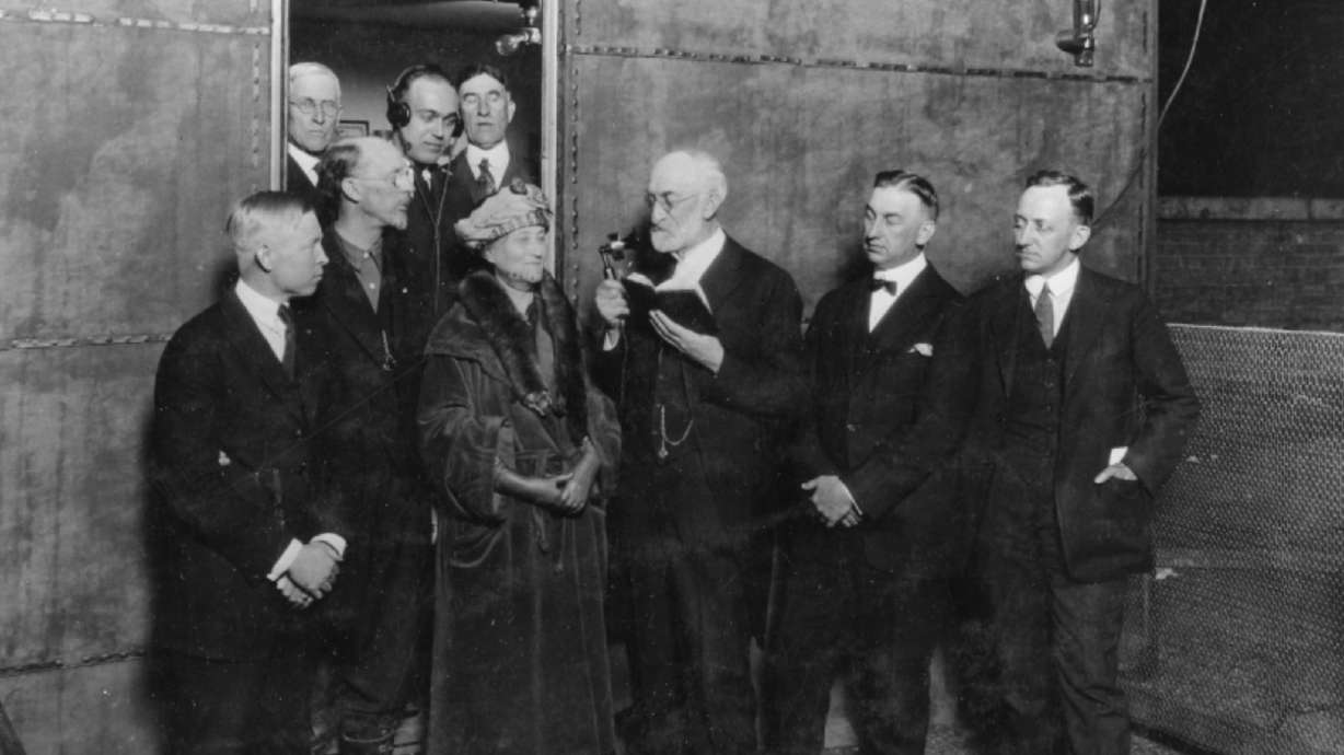 Heber J. Grant, president of The Church of Jesus Christ of Latter-day Saints, speaks into a KZN microphone during the station's first broadcast on Friday. KZN, which became KSL in 1924, turns 100 on Friday.