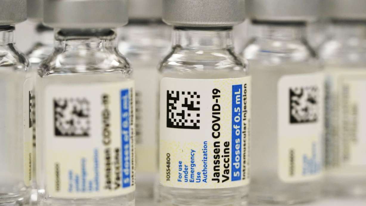 Vials of the Johnson & Johnson COVID-19 vaccine are seen at a pharmacy in Denver on March 6, 2021. On Thursday, U.S. regulators strictly limited who can receive this vaccine due to a rare but serious risk of blood clots.