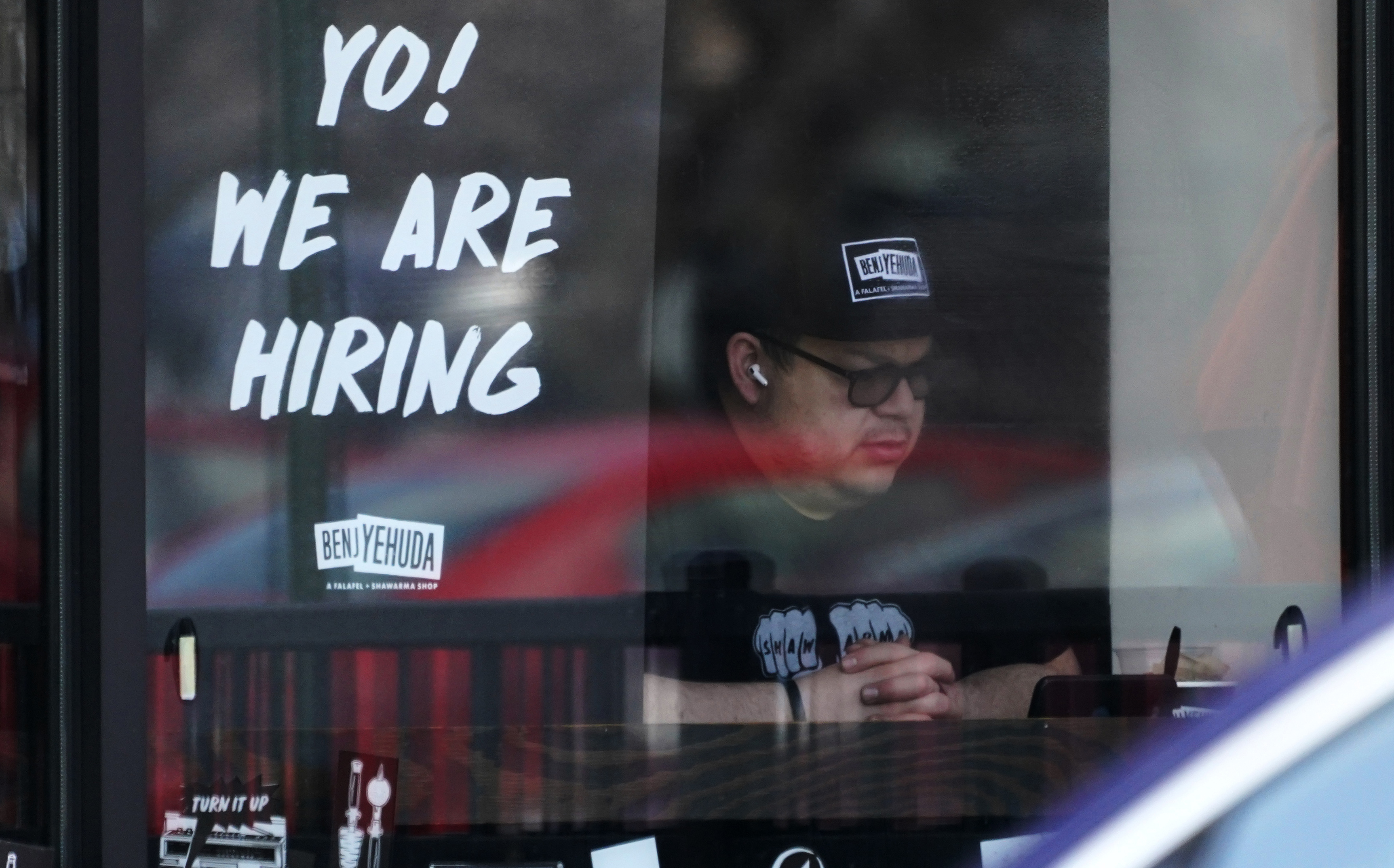 A hiring sign is displayed at a restaurant in Schaumburg, Ill., April 1. America's employers added 428,000 jobs in April, the Labor Department reported Friday.