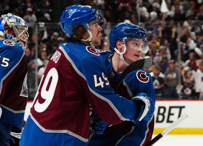 May 5, 2022; Denver, Colorado, USA; Colorado Avalanche defenseman Cale Makar (8) celebrates his overtime winning goal with defenseman Samuel Girard (49) against the Nashville Predators of game two of the first round of the 2022 Stanley Cup Playoffs at Ball Arena.