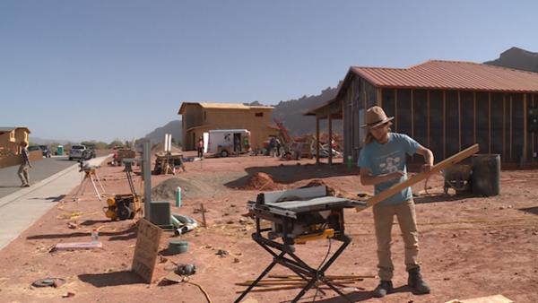 People work on building housing at Arroyo Crossing, a planned 300-unit development of affordable housing on land donated to the Moab Area Community Land Trust.