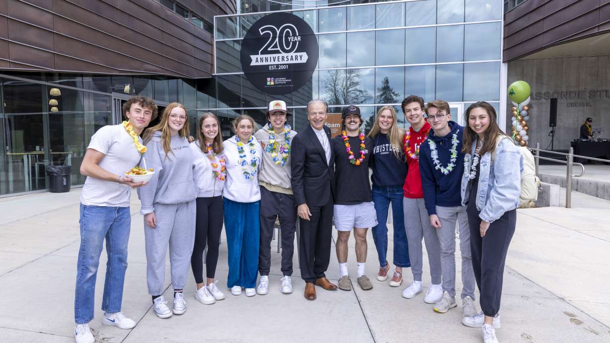 Pierre Lassonde poses for pictures with University of Utah students during the Lassonde Entrepreneur Institute's 20th-anniversary celebration at Lassonde Studios on Wednesday.