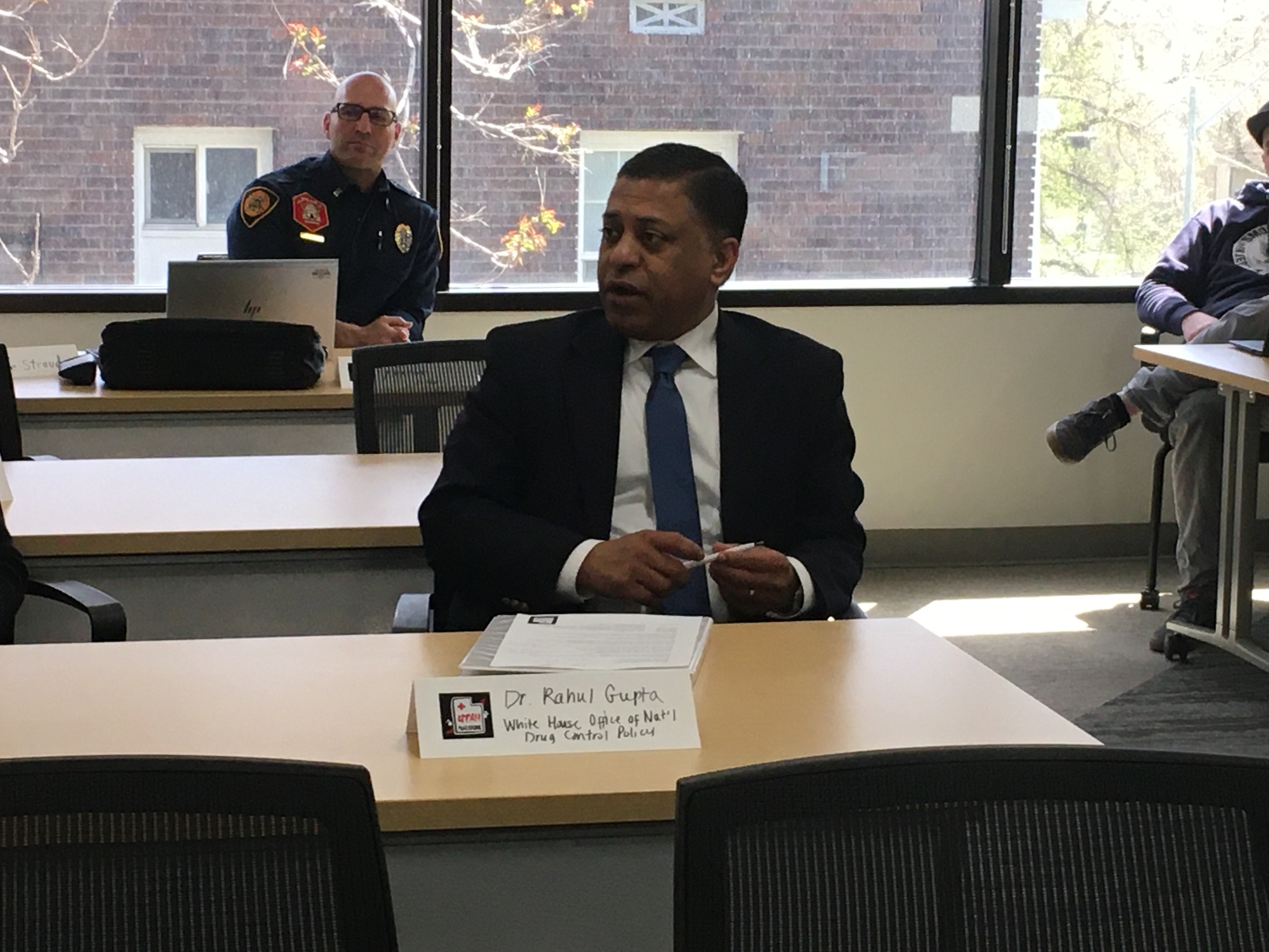 Dr. Rahul Gupta, director of the White House's Office of National Drug Control Policy, talks with community members during his visit Friday to Utah Naloxone, an opioid overdose prevention group in Salt Lake City. 