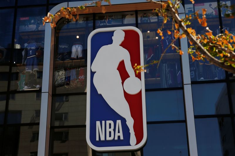 FILE PHOTO: An NBA logo is seen on the facade of its flagship store at the Wangfujing shopping street in Beijing, China October 8, 2019.