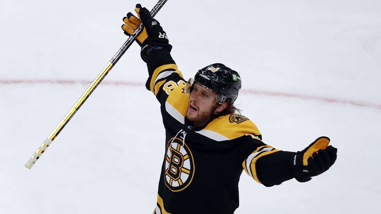 Boston Bruins' David Pastrnak celebrates his goal during the second period of Game 3 of an NHL hockey Stanley Cup first-round playoff series against the Carolina Hurricanes, Friday, May 6, 2022, in Boston.