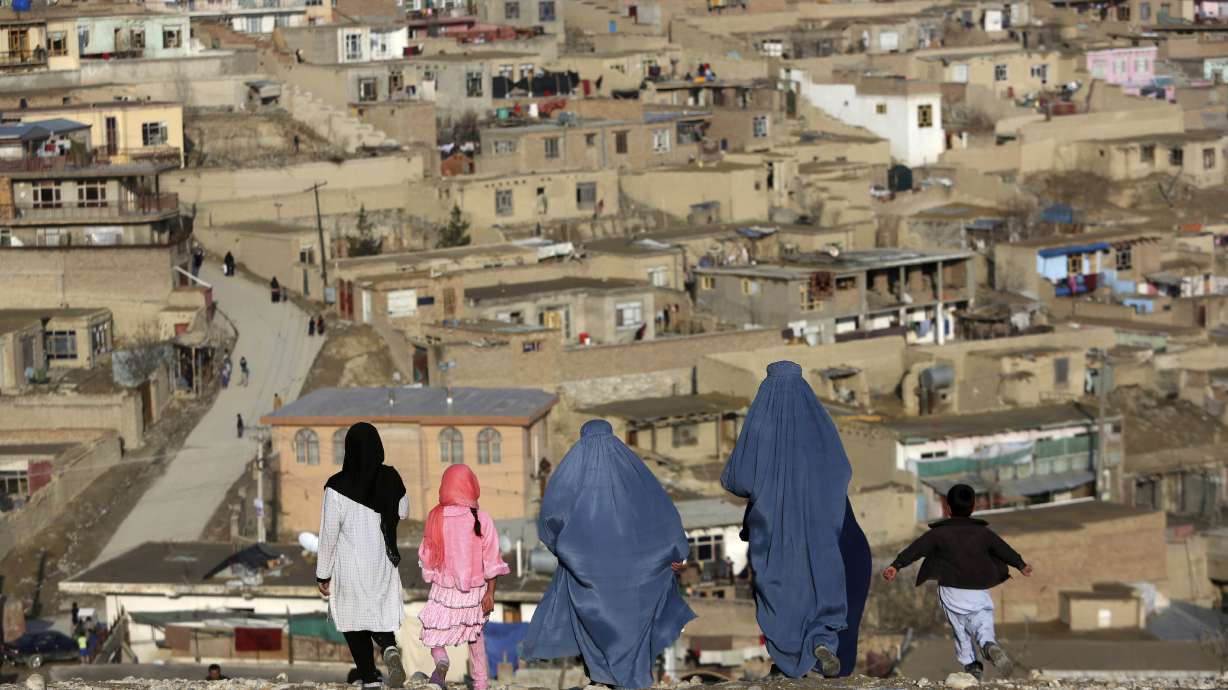 Burqa-clad women walk on Nadir Khan hilltop overlooking Kabul, Afghanistan, on March 16, 2017. Afghanistan’s Taliban rulers on Saturday ordered all Afghan women to wear the all-covering burqa in public, a sharp hard-line pivot that confirmed the worst fears of rights activists and was bound to further complicate Taliban dealings with an already distrustful international community.