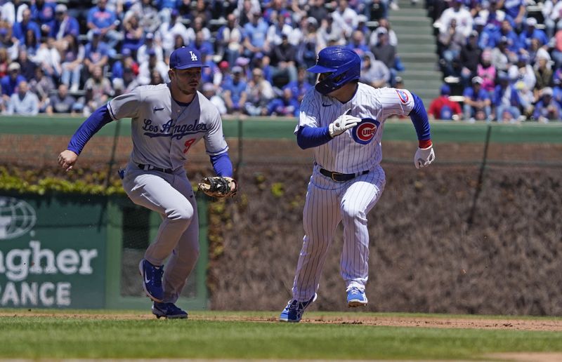 FILE PHOTO: May 7, 2022; Chicago, Illinois, USA; Los Angeles Dodgers second baseman Gavin Lux (9) tags out Chicago Cubs right fielder Seiya Suzuki (27) during the first inning at Wrigley Field.