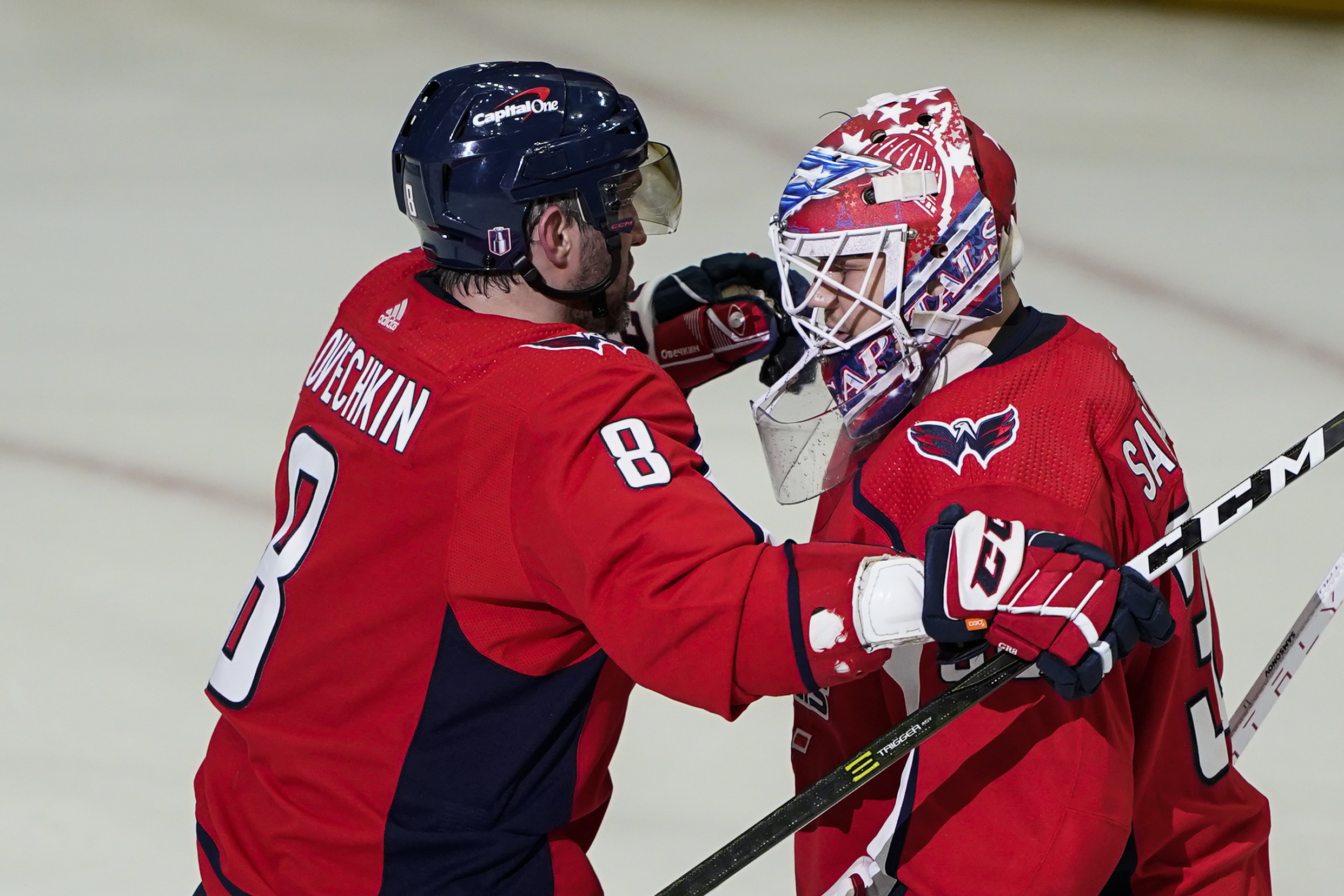 Washington Capitals left wing Alex Ovechkin and goaltender Ilya Samsonov embrace after Game 3 in the first-round of the NHL Stanley Cup hockey playoffs, Saturday, May 7, 2022, in Washington. The Capitals won 6-1. 