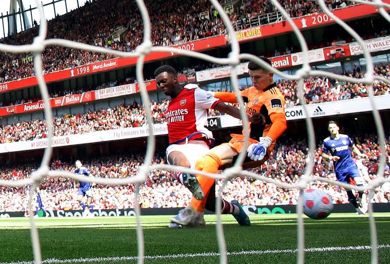 Soccer Football - Premier League - Arsenal v Leeds United - Emirates Stadium, London, Britain - May 8, 2022 Arsenal's Eddie Nketiah scores their first goal past Leeds United's Illan Meslier