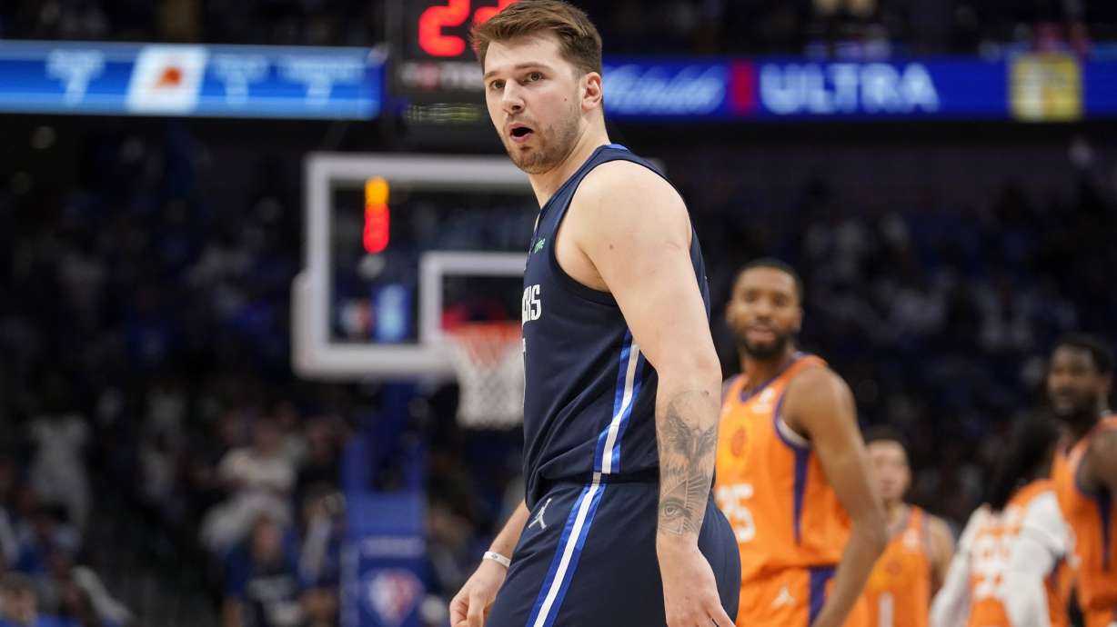 Dallas Mavericks guard Luka Doncic shouts at an official standing nearby in the first half of Game 4 of an NBA basketball second-round playoff series, Sunday, May 8, 2022, in Dallas.