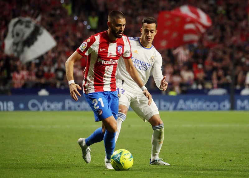Soccer Football - Spain - LaLiga - Atletico Madrid v Real Madrid - Wanda Metropolitano, Madrid, Spain - May 8, 2022 Atletico Madrid's Yannick Carrasco in action with Real Madrid's Lucas Vazquez