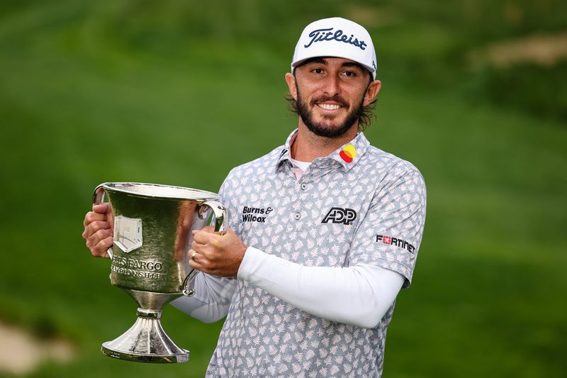 May 8, 2022; Potomac, Maryland, USA; Max Homa holds the Championship Trophy after winning the Wells Fargo Championship golf tournament.