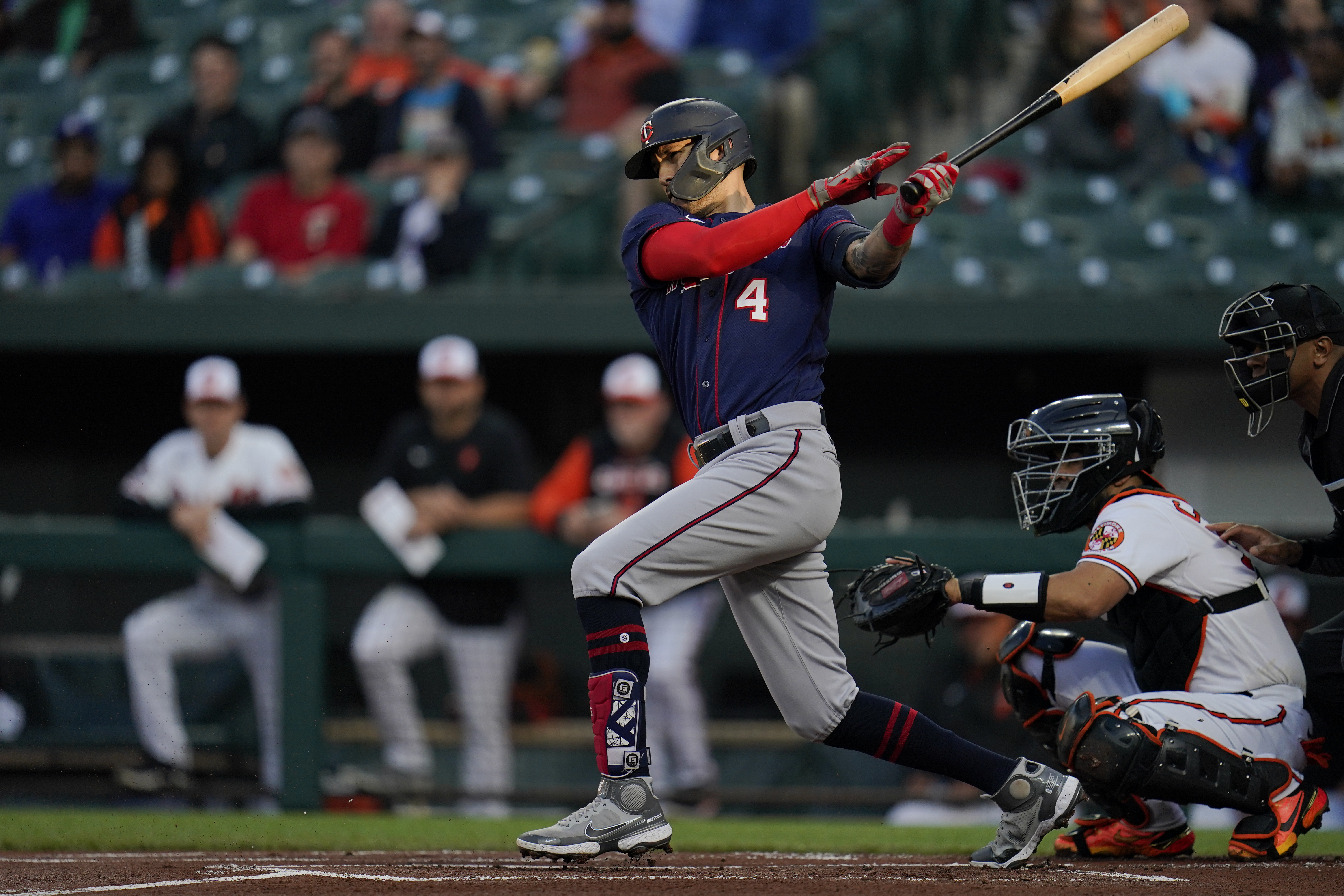 Minnesota Twins' Carlos Correa follows through on a swing against the Baltimore Orioles during the first inning of a baseball game, Thursday, May 5, 2022, in Baltimore. 