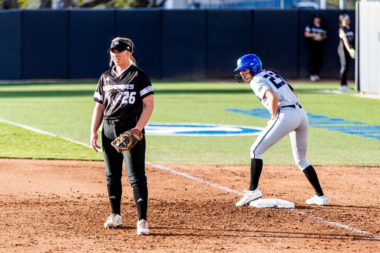 BYU's Violet Zavodnik, right, looks to run from first base during a game against Utah Valley, April 20, 2022 at Gail Miller Field in Provo.