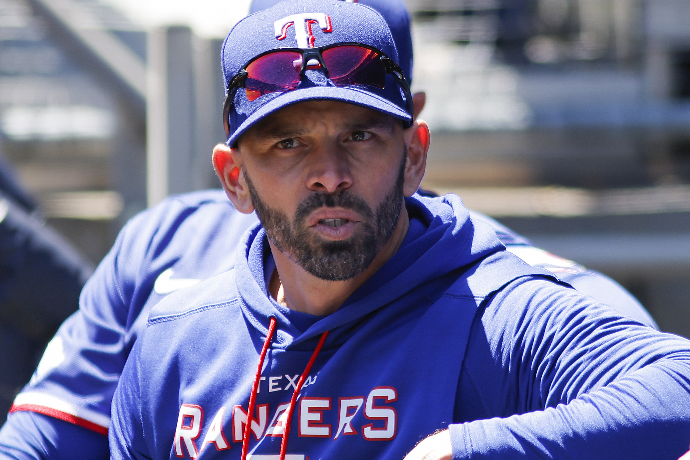 Texas Rangers' manager Chris Woodward sits at the dugout before a baseball game against the New York Yankees at Yankee Stadium, Monday, May 9, 2022, in New York. 