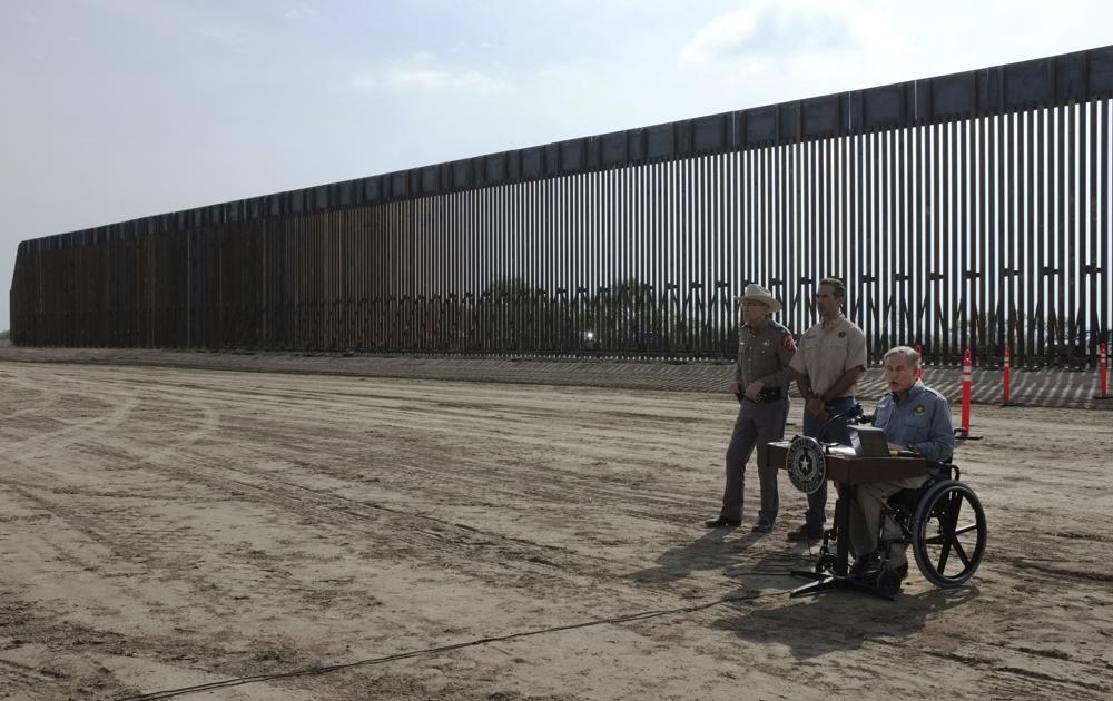 Texas Gov. Greg Abbott talks to the media during a news conference debuting the construction of the Texas border wall on Dec. 18, 2021, in Rio Grande City, Texas. About 3 in 10 worry that more immigration can cause native-born Americans to lose their economic, political and cultural influence, a new poll says.