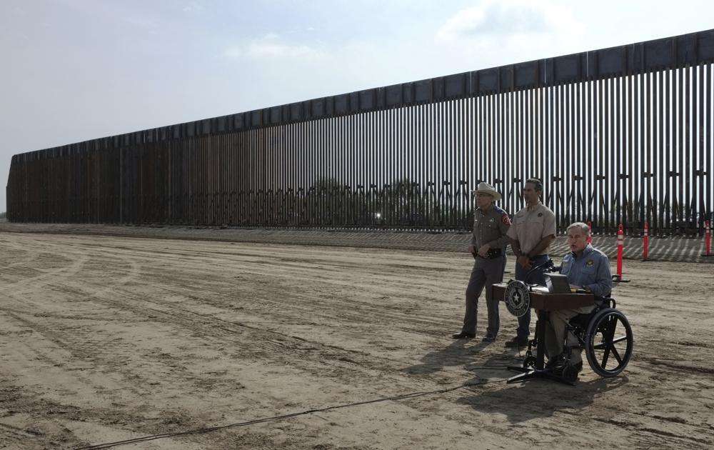 Texas Gov. Greg Abbott talks to the media during a news conference debuting the construction of the Texas border wall on Dec. 18, 2021, in Rio Grande City, Texas. About 3 in 10 worry that more immigration can cause native-born Americans to lose their economic, political and cultural influence, a new poll says.