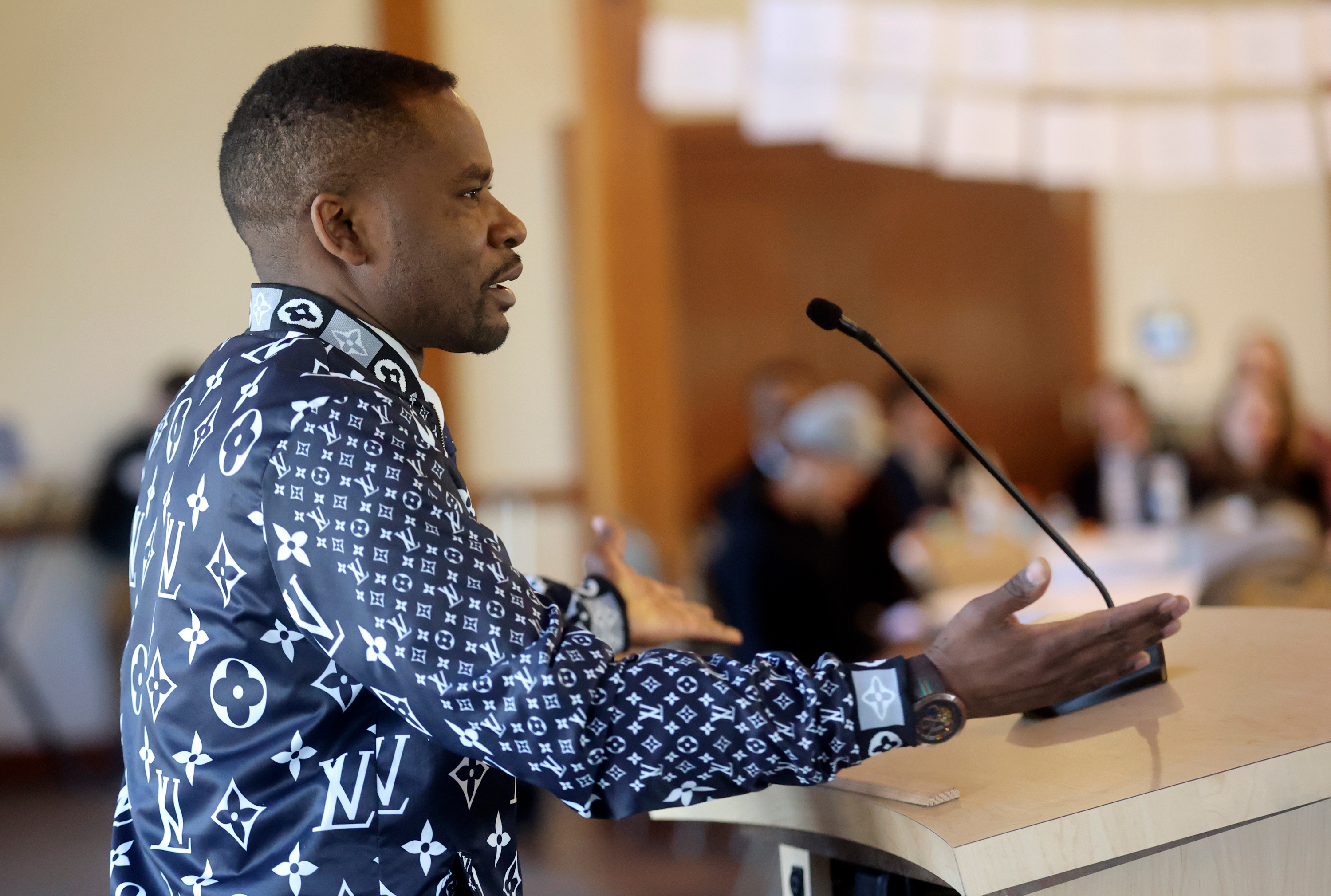 Chrispin Sangano, a refugee from the Democratic Republic of Congo, speaks about getting his bachelor’s of science in nursing from the University of Utah during the One Refugee Annual Celebration, to honor 64 college graduates who are also refugees, at The Garden Place in Salt Lake City, on Monday.