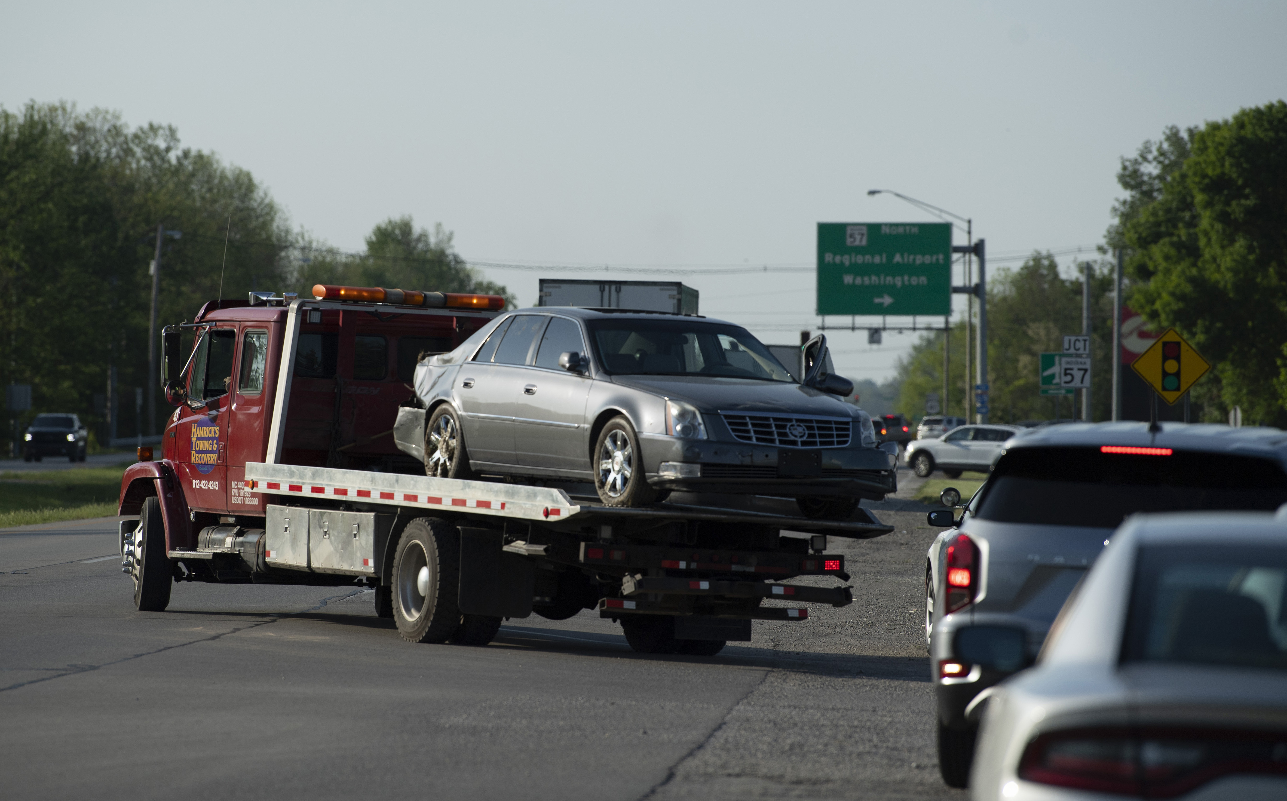 Hamrick's Towing & Recovery hauls the Cadillac sedan that fugitives Casey White and Vicky White, no relation, were driving when law enforcement officials forced them into a ditch in Evansville, Ind., after a short chase Monday.