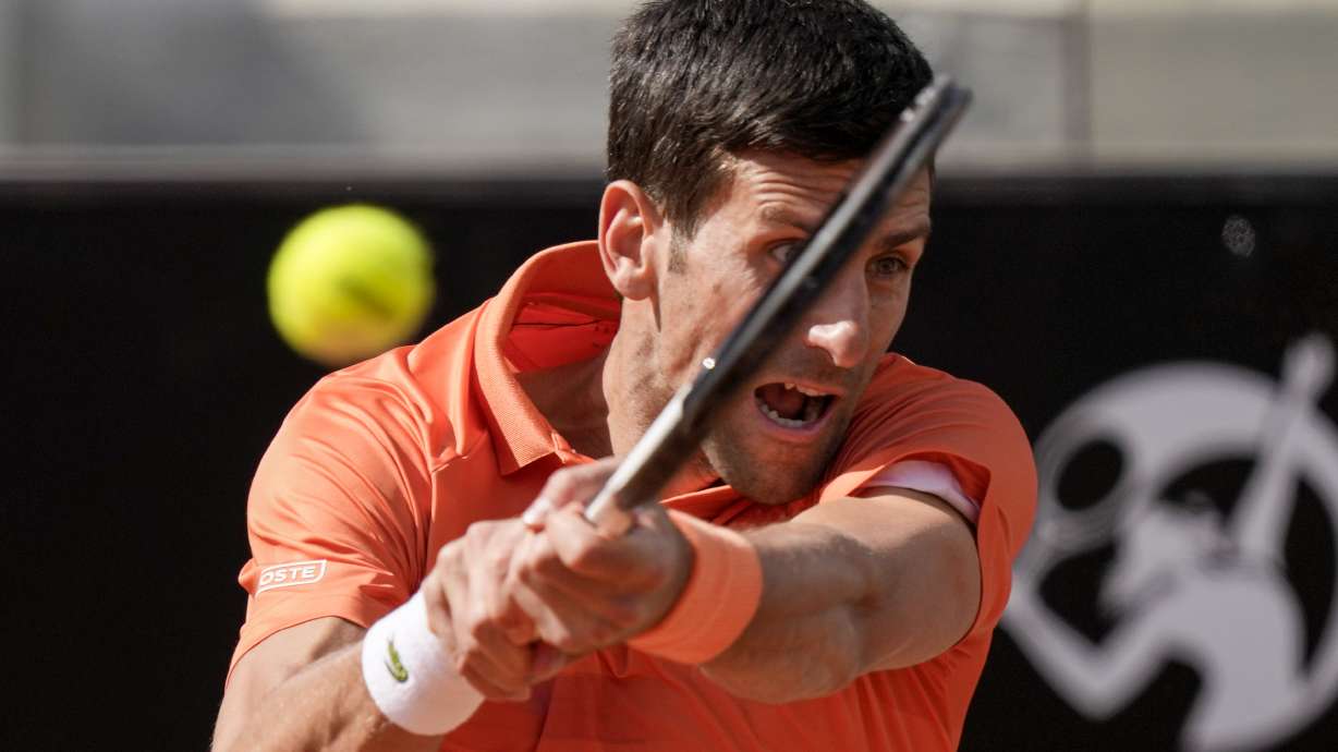 Novak Djokovic returns the ball to Aslan Karatsev during their match at the Italian Open tennis tournament, in Rome, Tuesday, May 10, 2022.