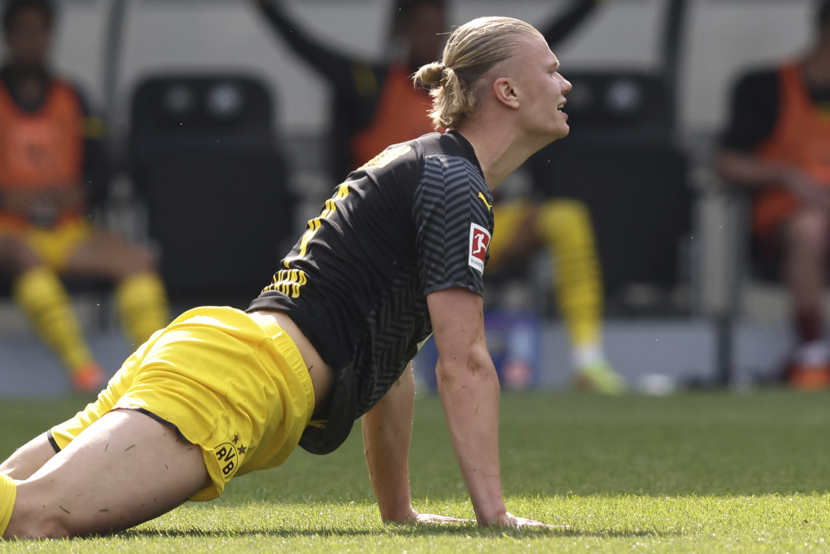 Dortmund's Erling Haaland lies on a German Bundesliga soccer match between Greuther Fuerth and Borussia Dortmund in Fuerth, Germany, Saturday, May 7, 2022.
