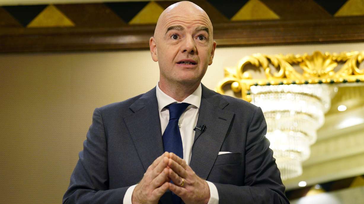 FILE - FIFA President Gianni Infantino speaks during an interview conducted with The Associated Press in Doha, Qatar, March 29, 2022. Infantino said migrant workers gain pride from hard work when he was questioned on Monday, May 2, 2022, about workers suffering in Qatar while building World Cup infrastructure.