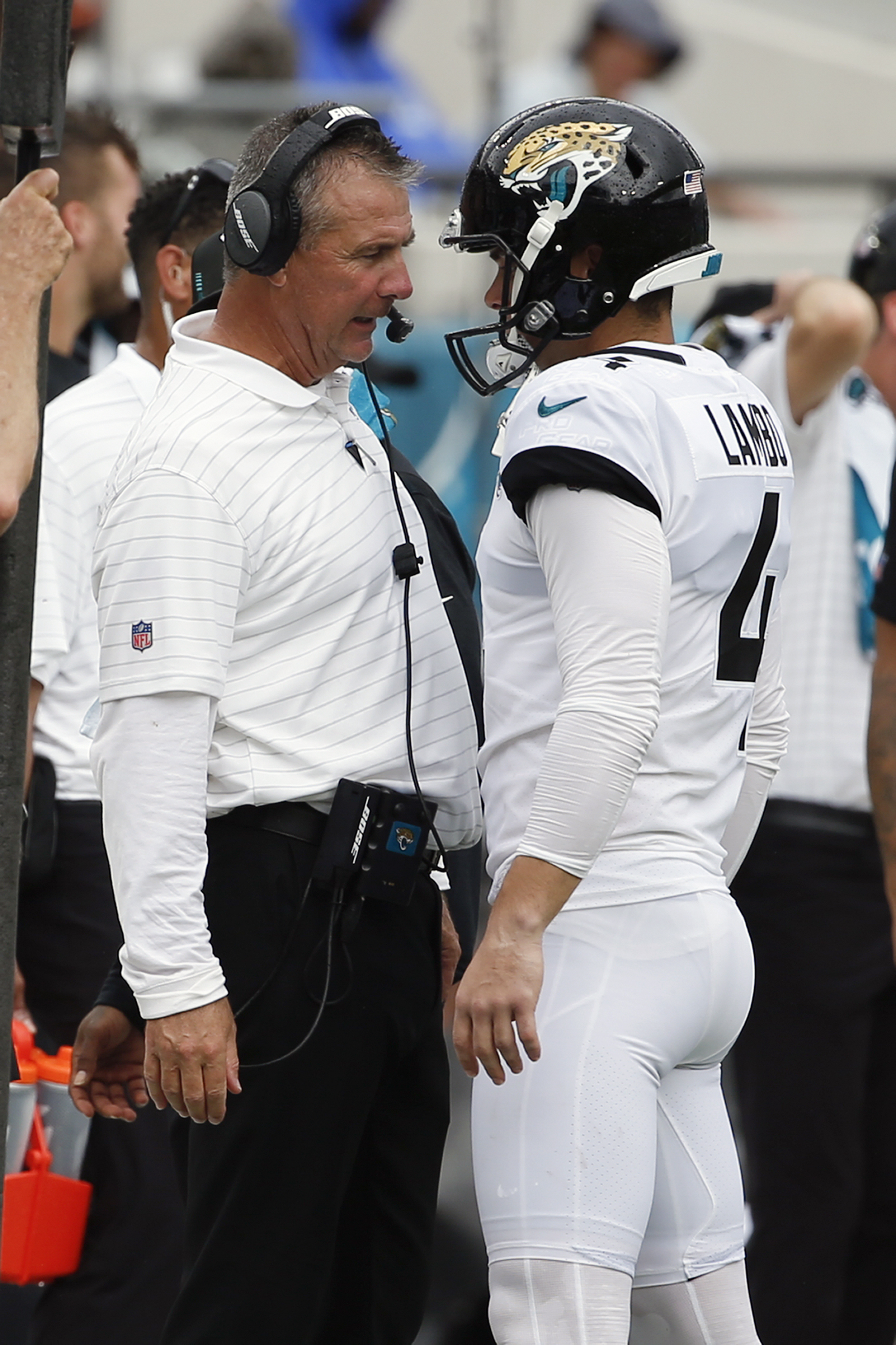 FILE - Jacksonville Jaguars head coach Urban Meyer, left, talks with place kicker Josh Lambo after Lambo missed his second field goal against the Denver Broncos during the first half of an NFL football game, Sunday, Sept. 19, 2021, in Jacksonville, Fla. Former NFL place-kicker Josh Lambo has filed a lawsuit Tuesday, May 10, 2022 against the Jacksonville Jaguars seeking more than $3.5 million in salary and damages for emotional distress caused by former head coach Urban Meyer.