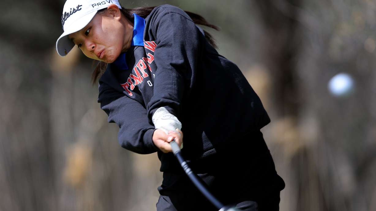 Timpview’s Sunbin Seo hammers a tee shot as she and other girls compete in the 5A golf championship at River Oaks Golf Course in Sandy, Utah on Tuesday, May 10, 2022.