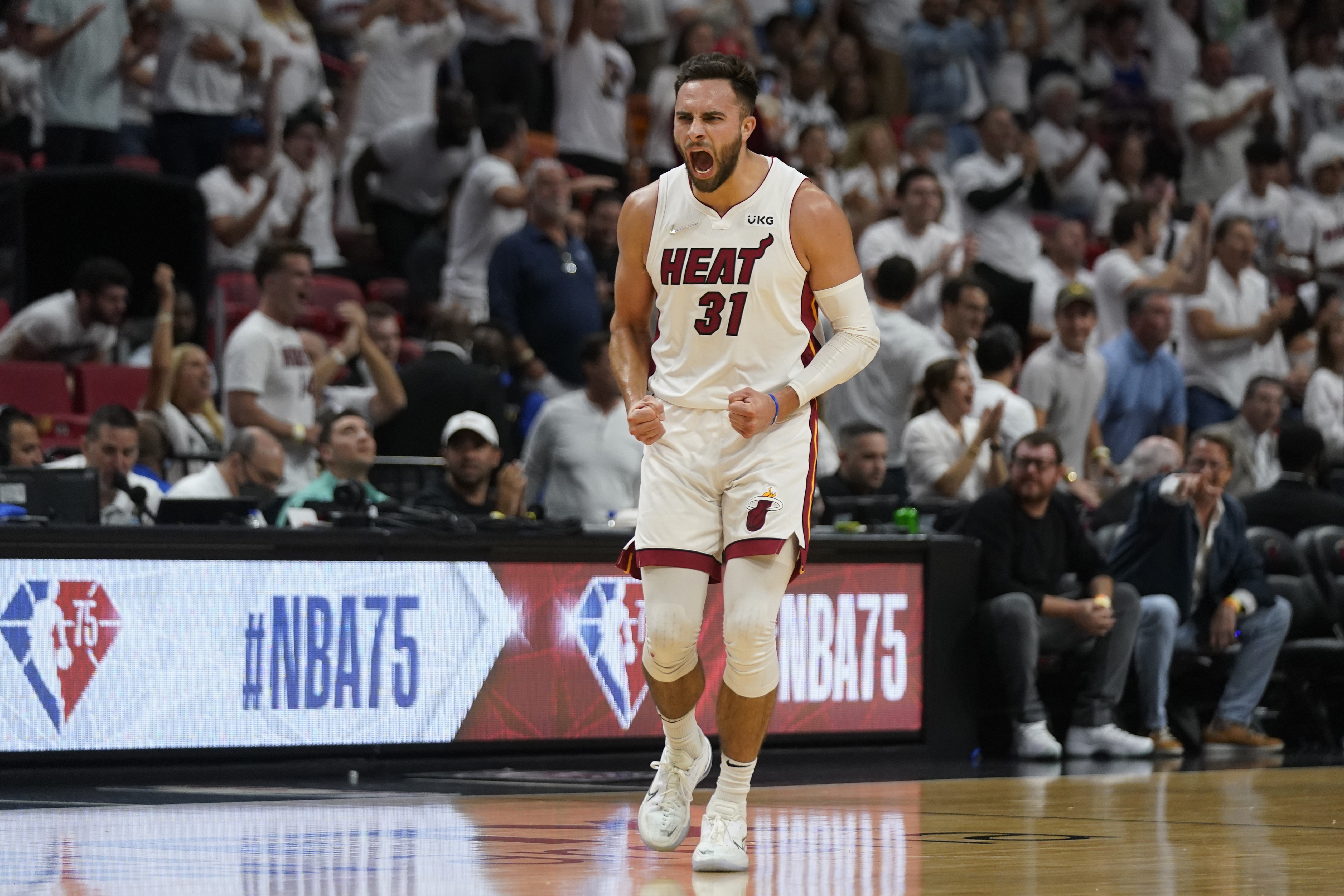 Miami Heat guard Max Strus (31) celebrates after scoring a three-point shot during the first half of Game 5 of an NBA basketball second-round playoff series against the Philadelphia 76ers, Tuesday, May 10, 2022, in Miami. 