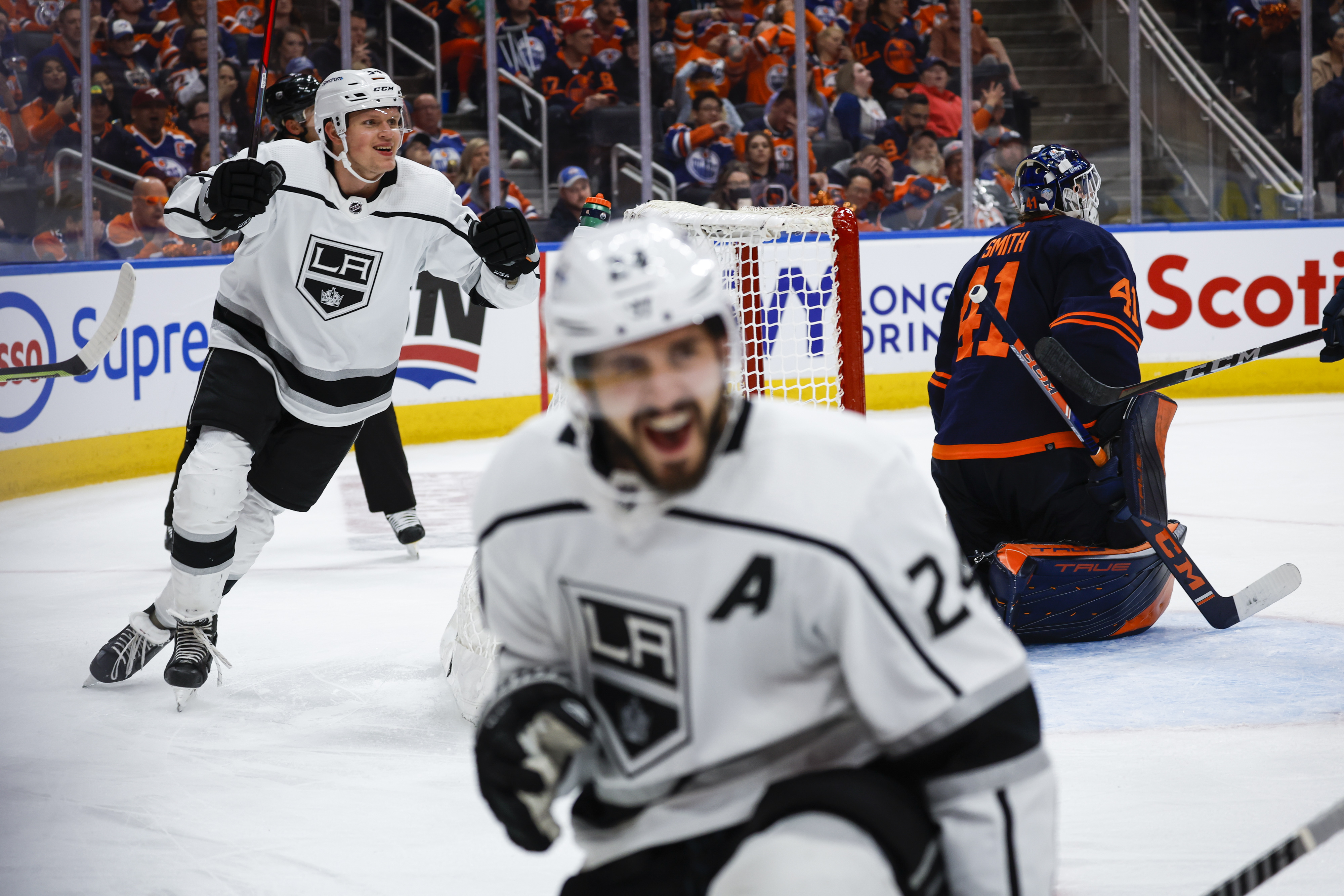 Los Angeles Kings center Phillip Danault, (24) celebrates his goal with teammate right wing Arthur Kaliyev, left, as Edmonton Oilers goalie Mike Smith looks away during the third period of Game 5 of an NHL hockey Stanley Cup first-round playoff series, Tuesday, May 10, 2022 in Edmonton, Alberta.