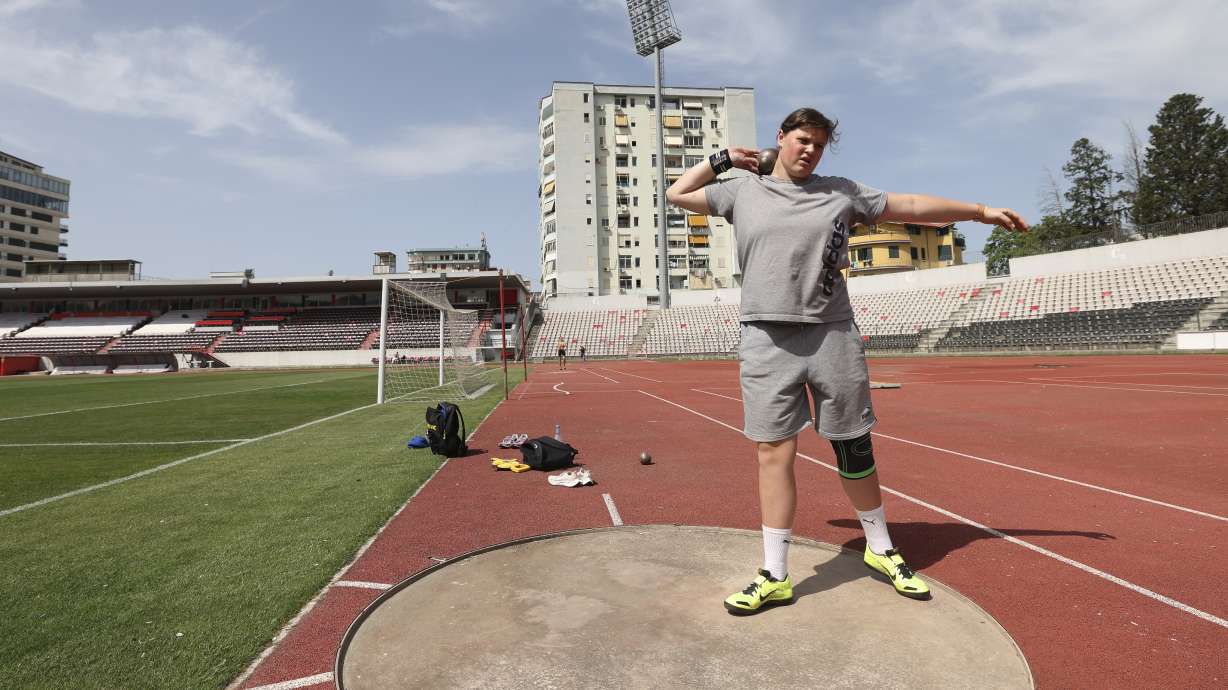 Ukrainian athlete Maria Larina, 17, practices during a training session at Elbasan Arena stadium in Elbasan, about 45 kilometers (30 miles) south of Tirana, Albania, Monday, May 9, 2022. After fleeing from a war zone, a group of young Ukrainian track and field athletes have made their way to safety in Albania. Their minds are still between the two countries.