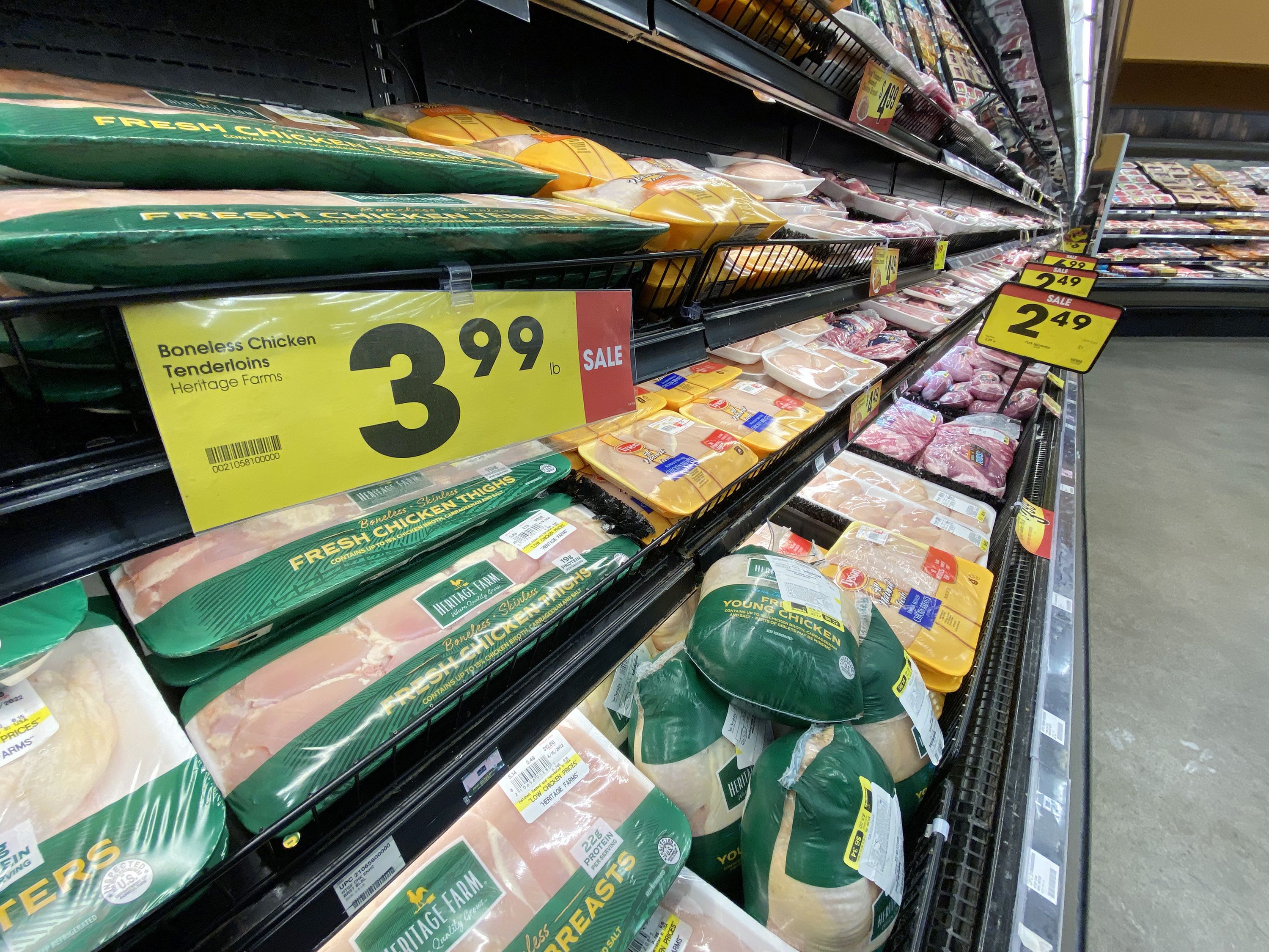 Chicken is pictured on the shelves of a local grocery store in Salt Lake City on April 11. U.S. inflation chilled slightly in April, coming in at an annual rate of 8.3%.