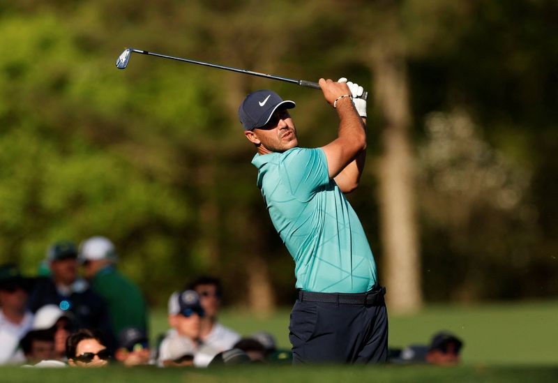 FILE PHOTO: Golf - The Masters - Augusta National Golf Club - Augusta, Georgia, U.S. - April 7, 2022 Brooks Koepka of the U.S. tees off on the 13th during the first round