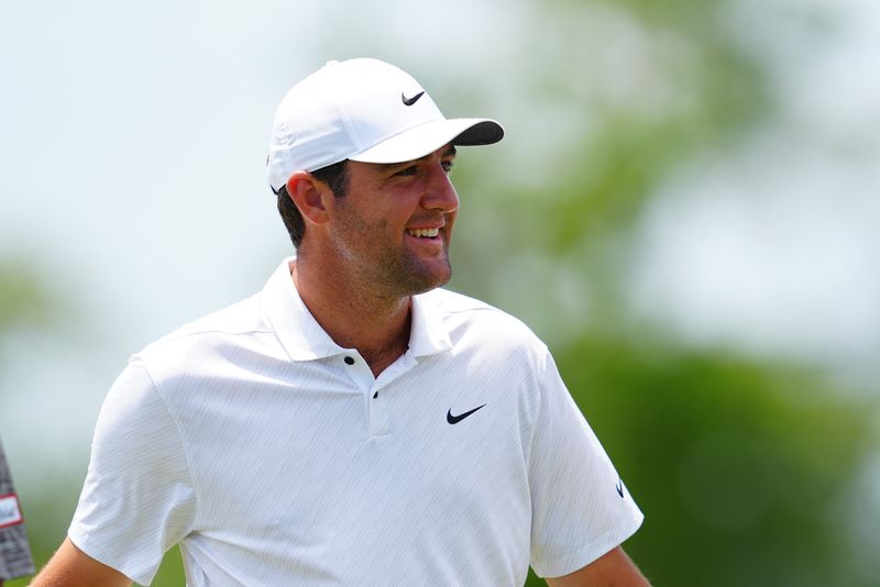 FILE PHOTO: Apr 22, 2022; Avondale, Louisiana, USA; Scottie Scheffler smiles on the ninth hole green during the second round of the Zurich Classic of New Orleans golf tournament.