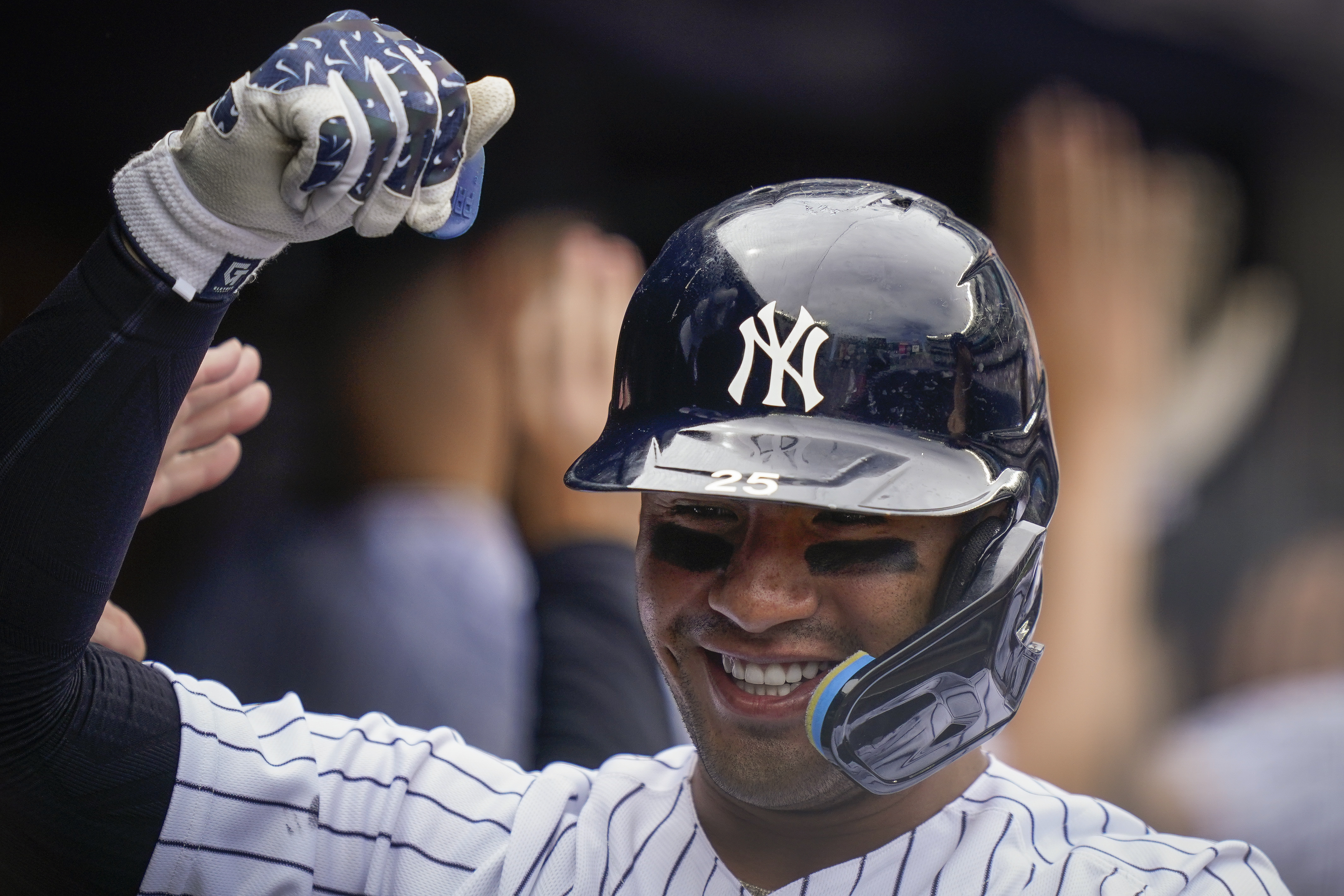 New York Yankees' Gleyber Torres celebrates in the dugout after hitting a three-run home run off Toronto Blue Jays starting pitcher Jose Berrios (17) in the fourth inning of a baseball game, Wednesday, May 11, 2022, in New York. 