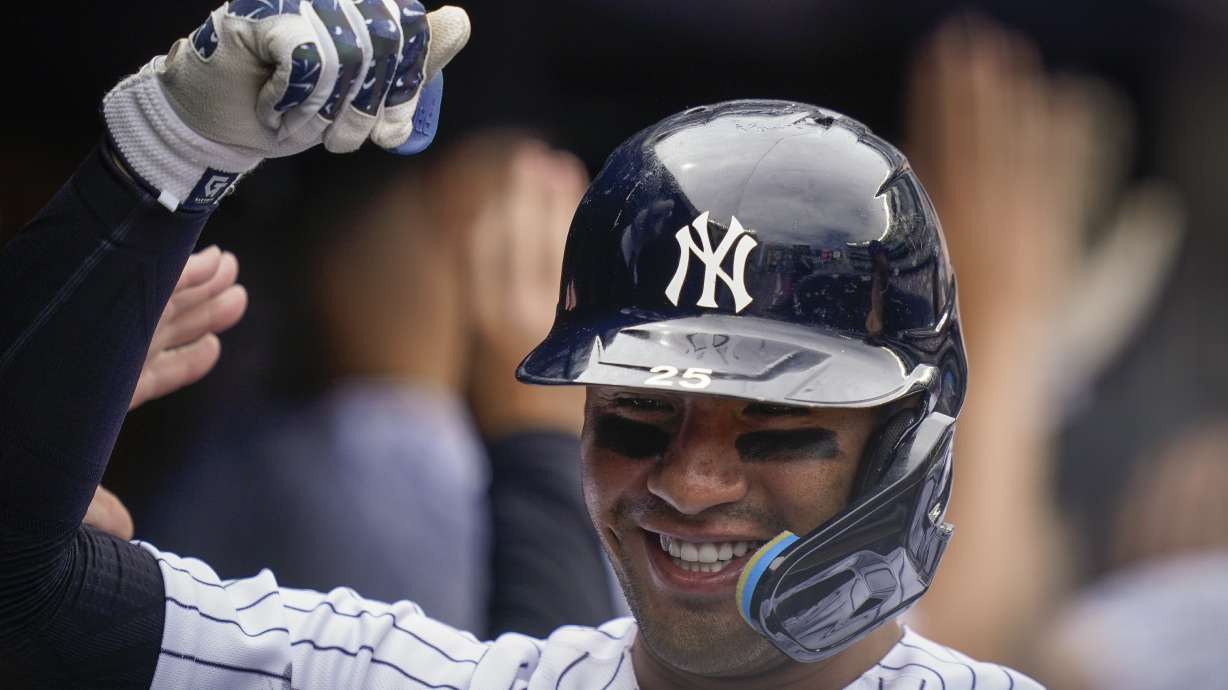 New York Yankees' Gleyber Torres celebrates in the dugout after hitting a three-run home run off Toronto Blue Jays starting pitcher Jose Berrios (17) in the fourth inning of a baseball game, Wednesday, May 11, 2022, in New York.