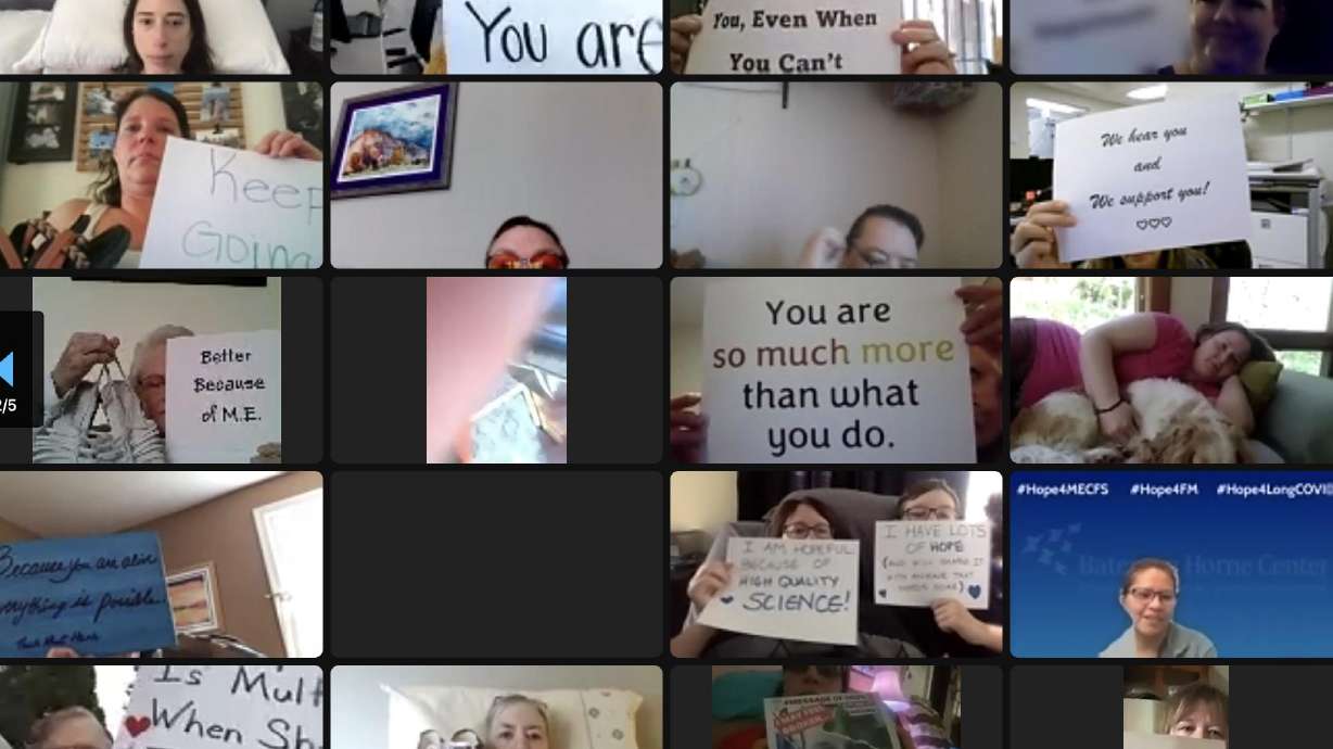 People with chronic illnesses and those caring for them hold up motivational signs during a Zoom call on Wednesday. Thursday is ME/CFS and Fibromyalgia Awareness Day.