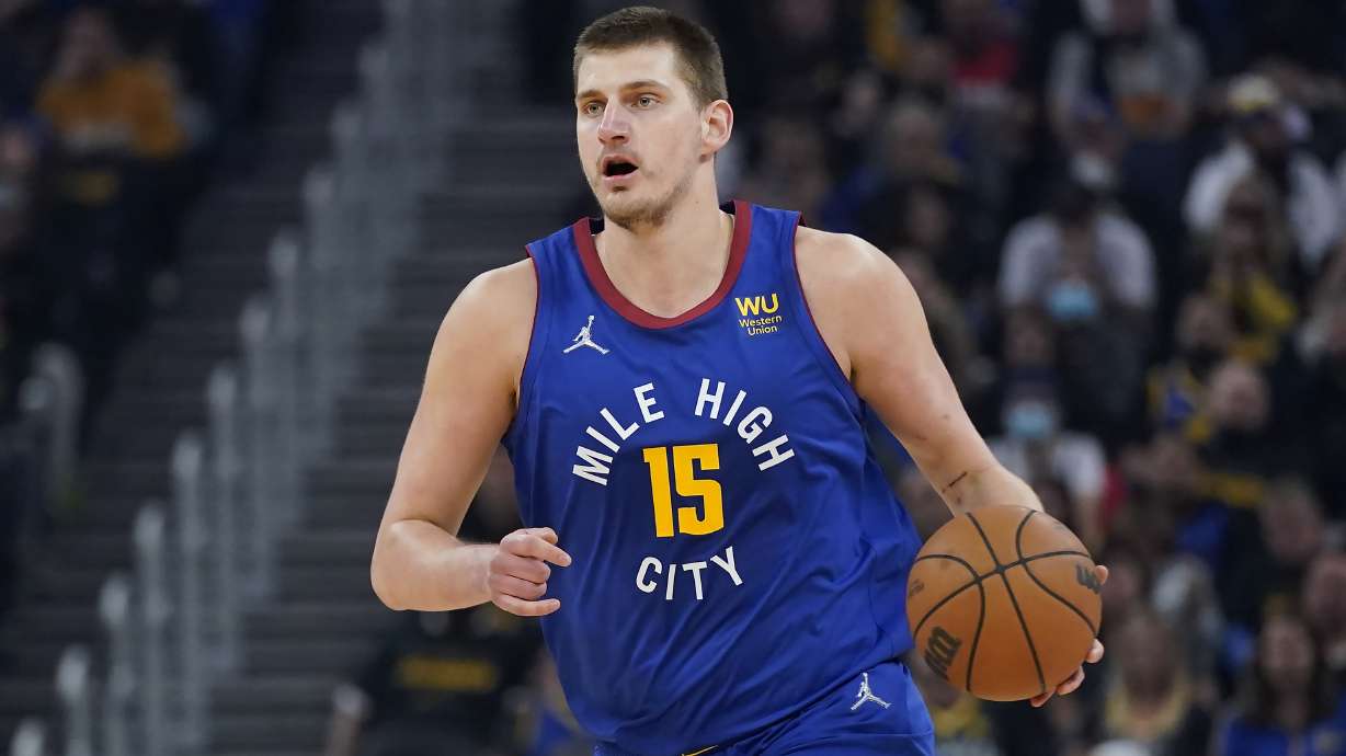 FILE - Denver Nuggets center Nikola Jokic (15) dribbles the ball up the court against the Golden State Warriors during the first half of Game 2 of an NBA basketball first-round playoff series in San Francisco, Monday, April 18, 2022. Jokic has won his second consecutive Most Valuable Player award after a season in which he finished with numbers never before seen in NBA history, a person familiar with the decision told The Associated Press on Monday, May 9, 2022.