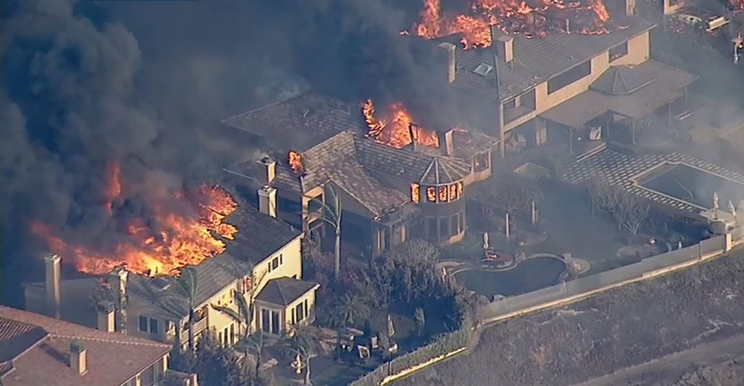 Multiple homes are ablaze in the area.