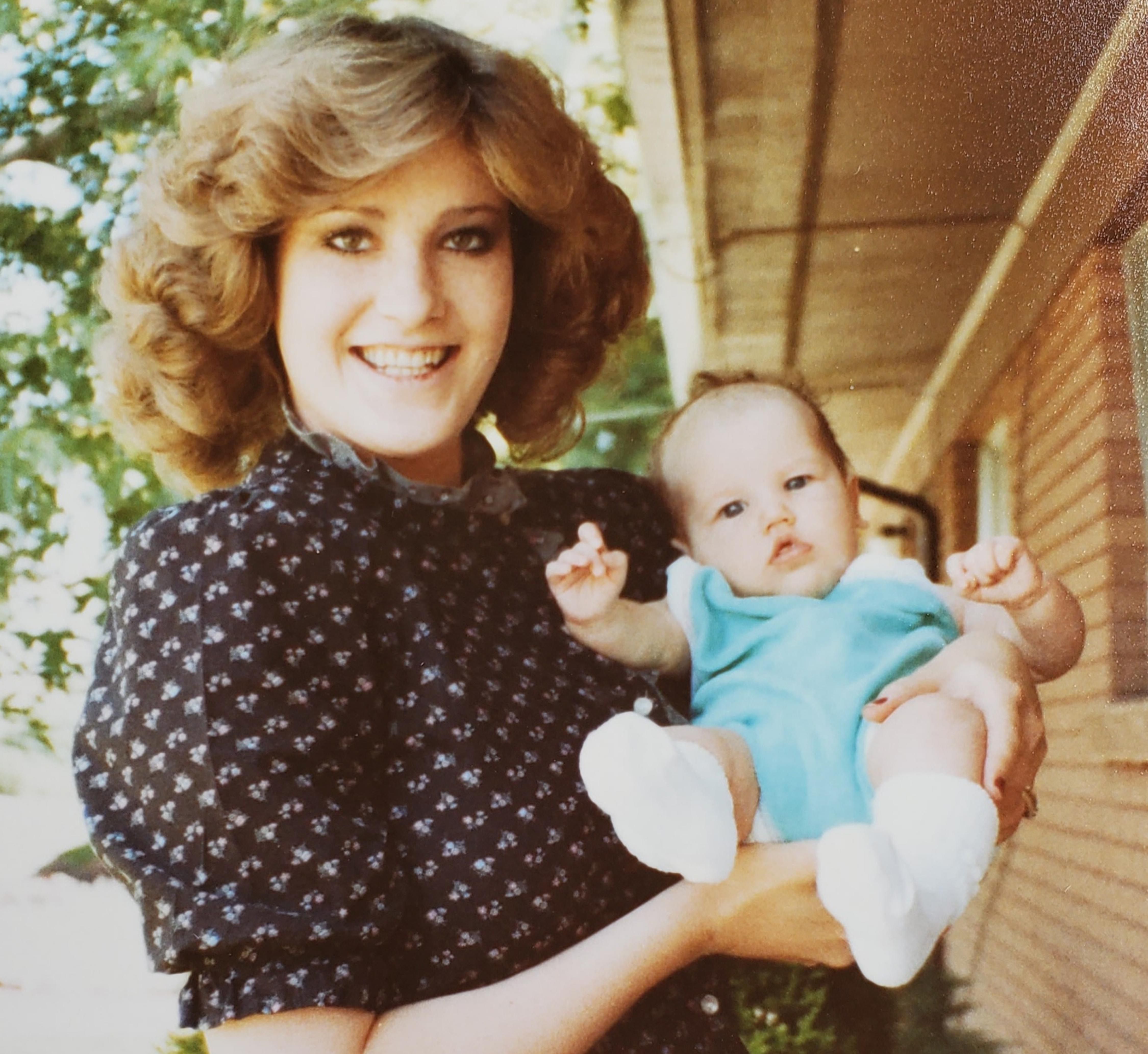 Brenda Lafferty holds her daughter, Erica Lafferty, on Sunday, June 5, 1983, about one year before they were murdered.