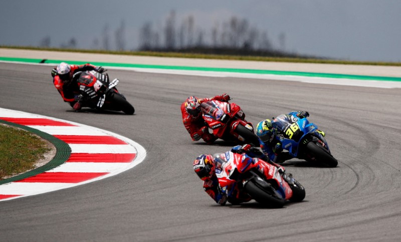 FILE PHOTO: MotoGP - Portuguese Grand Prix - Algarve International Circuit, Portimao, Portugal - April 24, 2022  Pramac Racing's Johann Zarco, Team Suzuki Ecstar's Joan Mir and Ducati Lenovo's Jack Miller in action during the MotoGP race