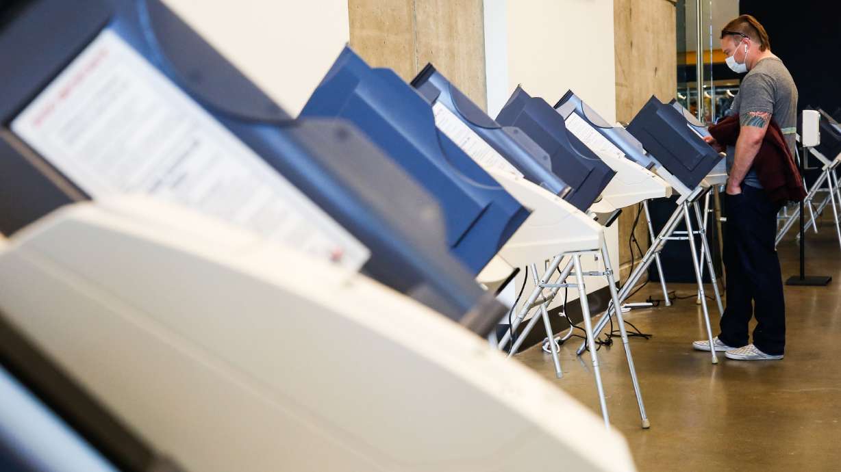 A voter fills in a ballot at Vivint Arena in Salt Lake City on Election Day, Nov. 3, 2020. Attorneys for the Utah Legislature pushed back against a lawsuit claiming the redistricting process was rife with unconstitutional gerrymandering in a motion to dismiss last Monday.