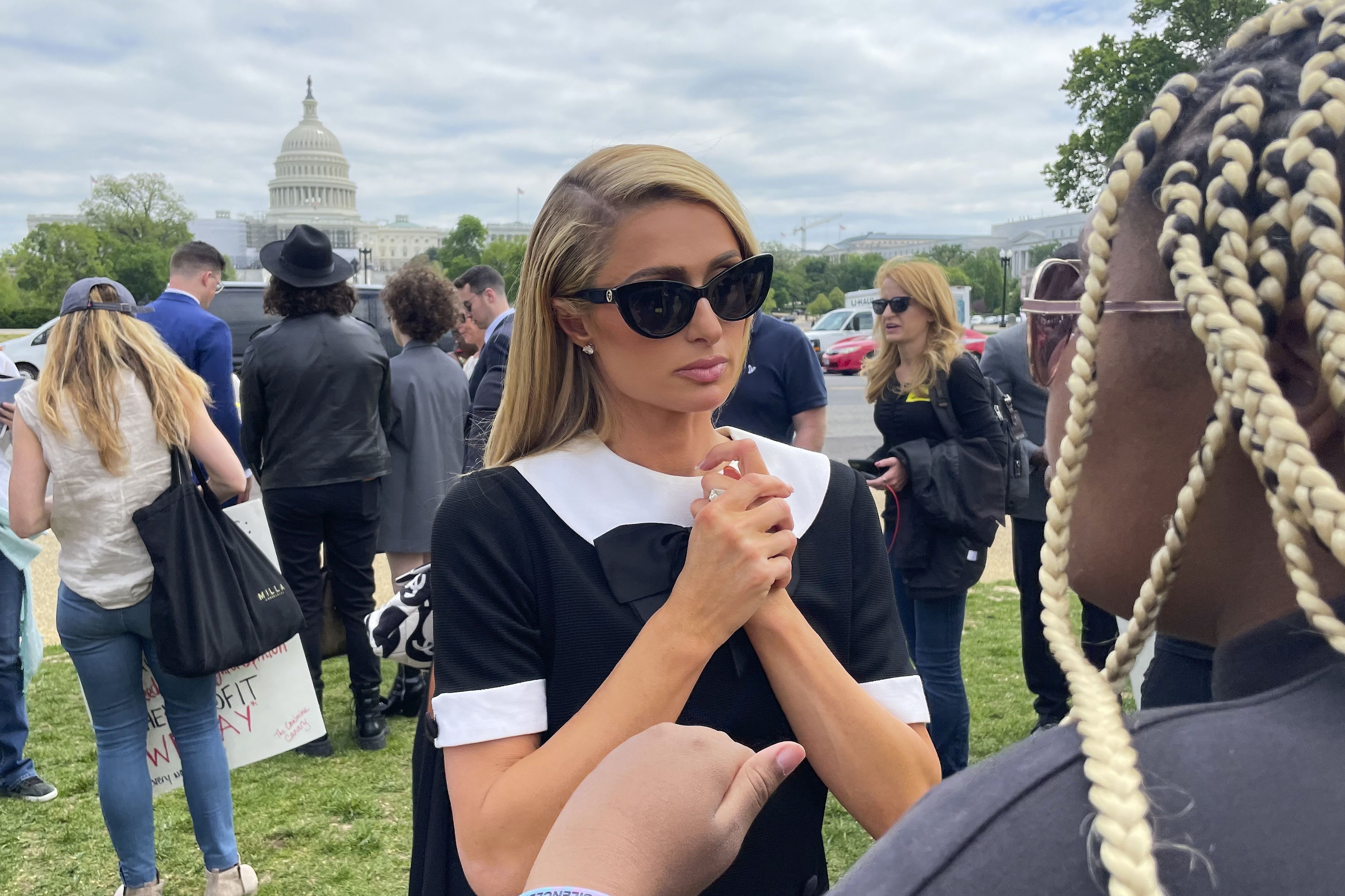 Paris Hilton, meets with a supporter after speaking at a Stop Institutional Child Abuse event on Wednesday in Washington. Hilton was in Washington advocating efforts to improve protections of youth in residential programs and facilities.